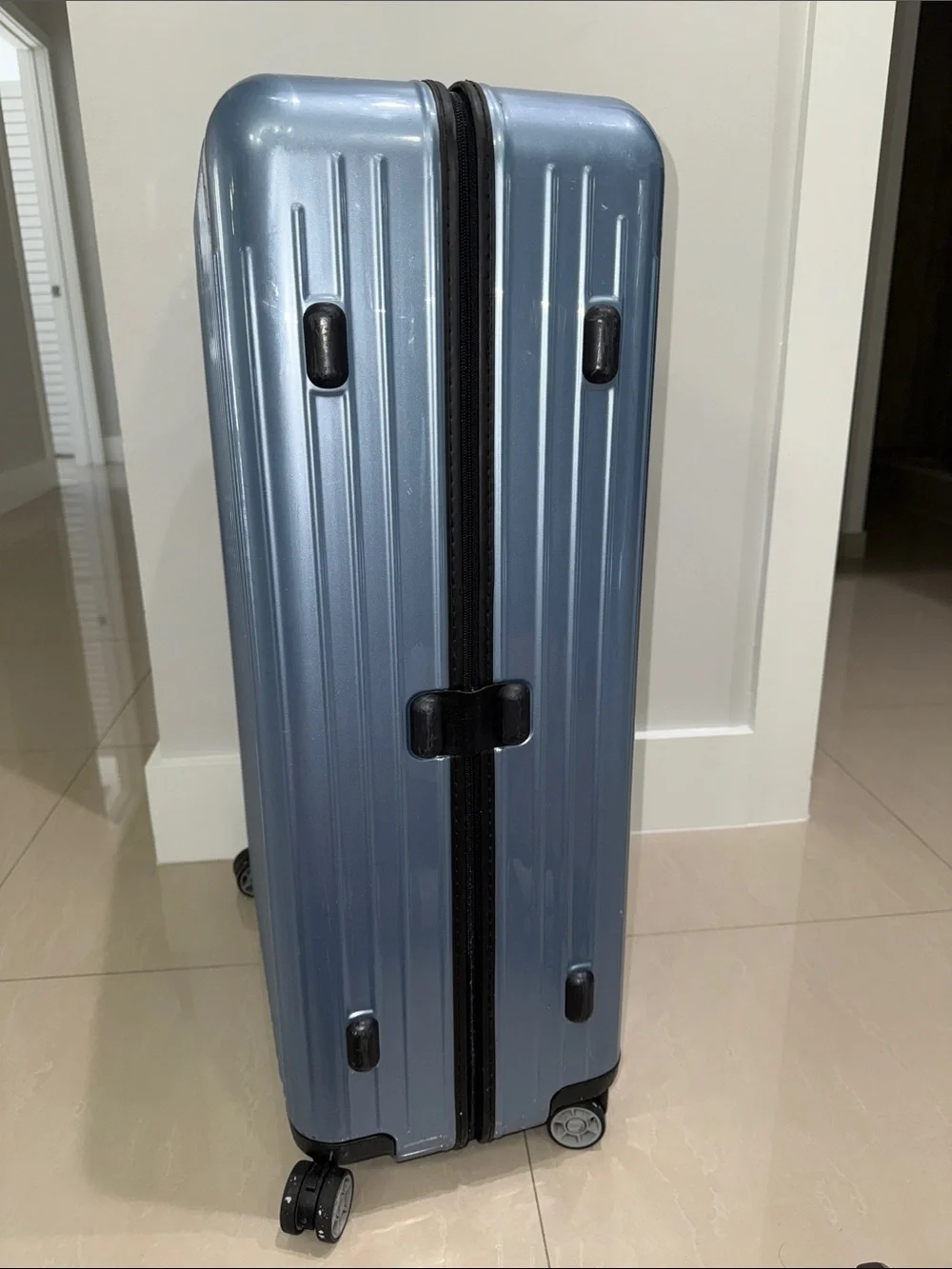 RIMOWA Salsa Air Multiwheel acrylic suitcase in Ice Blue.